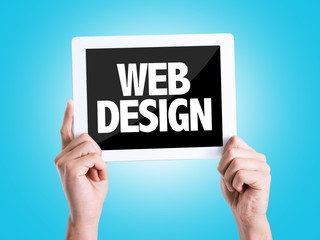 Tablet pc with text Web Design with blue background