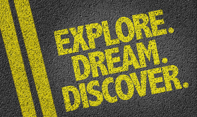Explore. Dream. Discover. written on the road