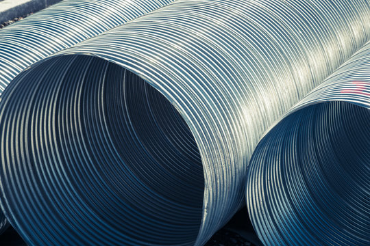 Big New Metal Housing Pipes For City Underground Water Heating System. Abstract Background.