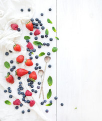 Fototapeta na wymiar Berry frame with copy space on right. Strawberries, raspberries