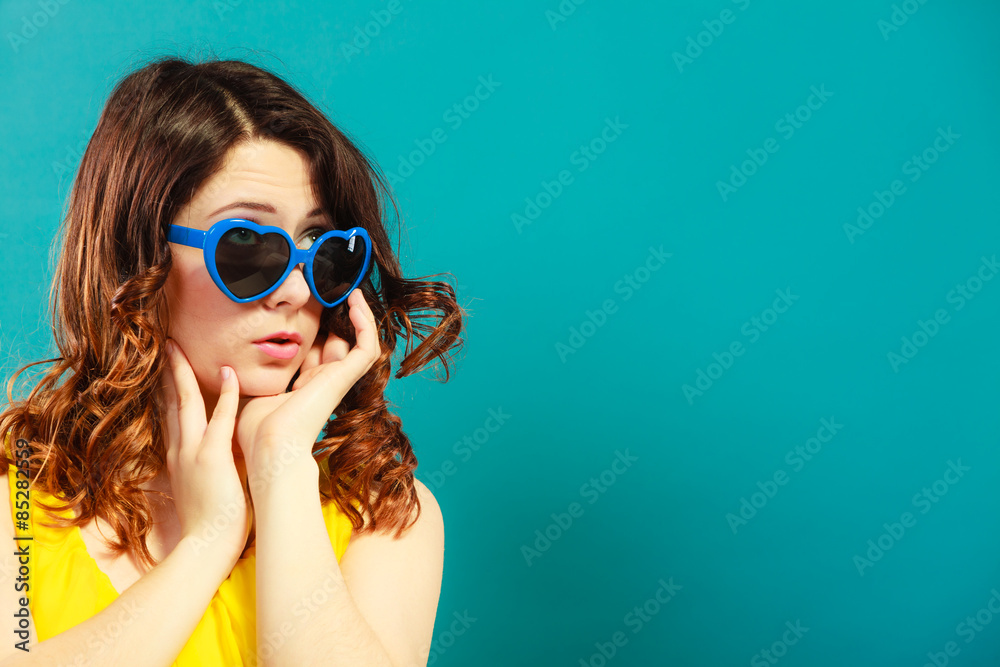 Wall mural girl in blue sunglasses portrait