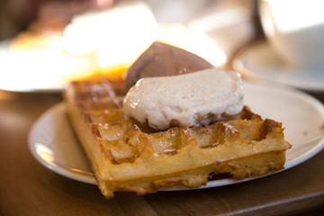 Plate of delicious ice cream on the waffle