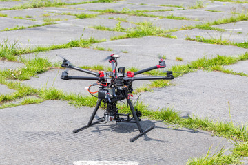 Obraz premium Small drone on the ground