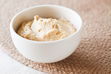 Hummus Dip in simple white bowl. 