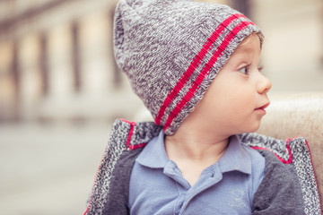 happy little baby boy wearing hat