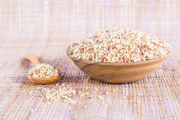 brown rice in a wooden bowl