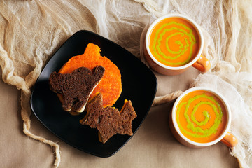 Halloween Grilled Cheese Sandwiches in the shape of a pumpkin, black cat and bat. Witches Brew Soup with pesto swirls. 