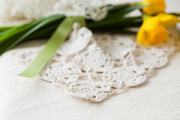 Daffodil Bouquet & Lacy Crochet with copy space, selective focus in the foreground. 