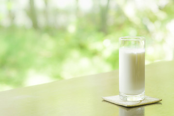 A glass of milk in the morning garden