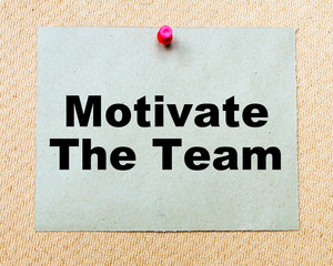 Motivate The Team  written on paper note