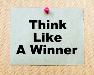 Think Like a Winner  written on paper note