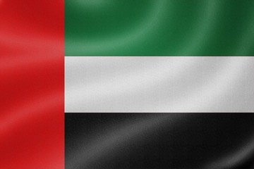 United Arab Emirates flag on the fabric texture background
