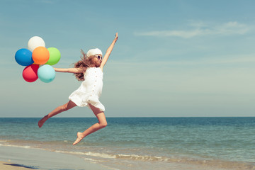 Fototapeta na wymiar Teen girl jumping on the beach