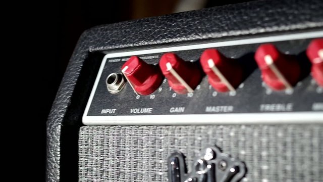 Plugging into an electric guitar amplifier