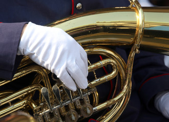 trombone in brass and the hand of musician