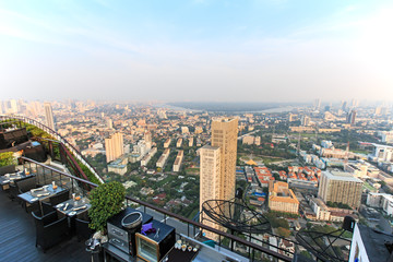 Bangkok, Thailand - April 15,2015: Bangkok at sunset viewed from a roof top bar