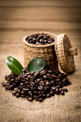 pile of fresh beans and green leaves and spoon in jar