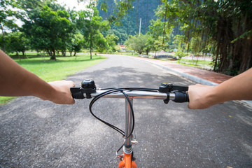 Fototapeta na wymiar woman riding a bicycle in park