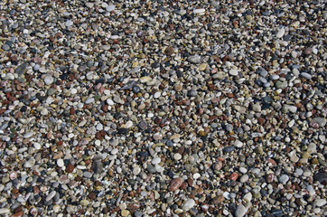 wet Pebbly beach stone background in Mediterranean sea beach