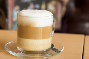 coffee latte with milk froth in cafe