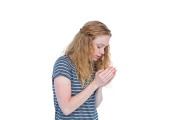 Pretty blonde looking at her hands 