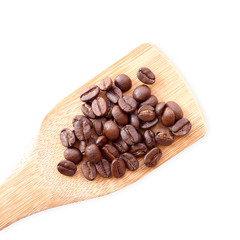 coffee beans in wooden scoop on white background