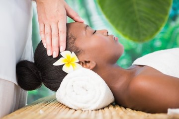 Obraz na płótnie Canvas Pretty woman enjoying a head massage