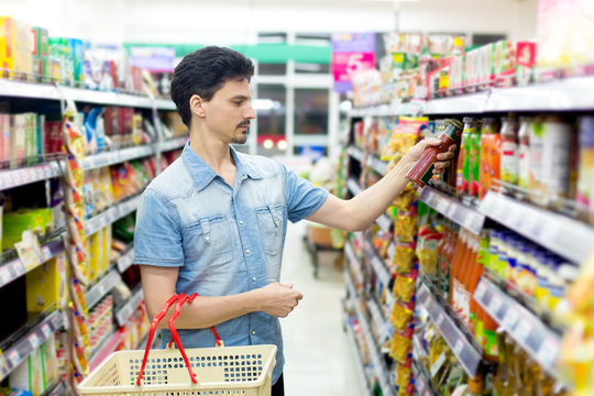man in a supermarket to buy ketchup