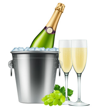 Champagne bottle in an ice bucket with two flutes and grapes. 