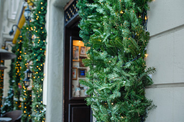 Open door with decorated Christmas tree