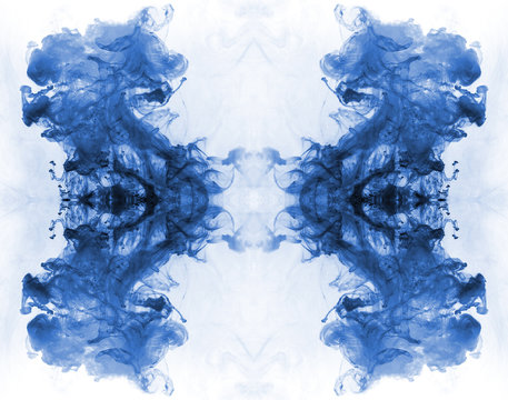 Blue Ink Forming Patterns Resembling Rorschach Test Ink Blots.