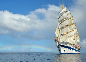 Fototapeta na wymiar Sailing ship on the background of the rainbow