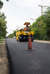 Heavy Vibration roller compactor at asphalt pavement works for road repairing