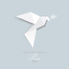 international day of peace- vector illustration of white origami dove with olive branch- flat design style