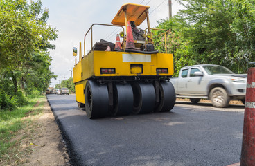 Fototapeta na wymiar Heavy Vibration roller compactor at asphalt pavement works for road repairing