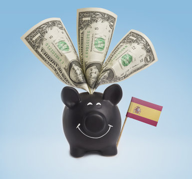 One dollar banknotes in a happy piggybank of Spain.(series)