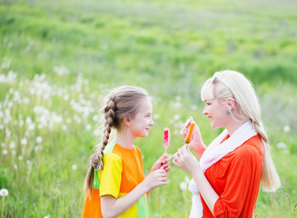 Fototapeta premium Happy family eating ice-cream outdoors