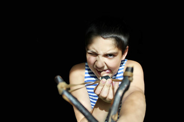 Bad boy with a wooden slingshot