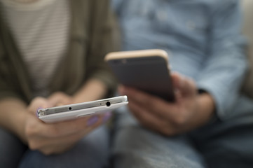 The couple has a smartphone each