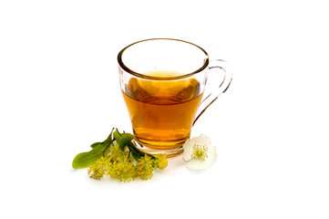 the glass of bright red tea decorated with a small flower