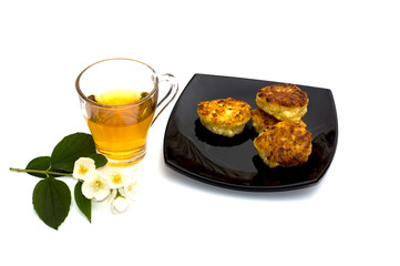 plate with cheesecakes and flower tea
