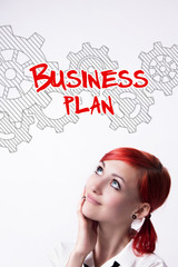 Red-haired girl is developing a business plan