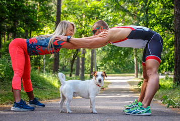 Man and woman in sportswear doing exercises