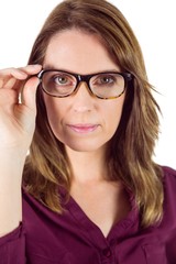 Obraz premium Pretty woman with glasses looking at camera 