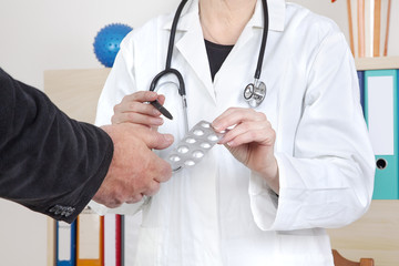 Doctor explaining patient's tablets