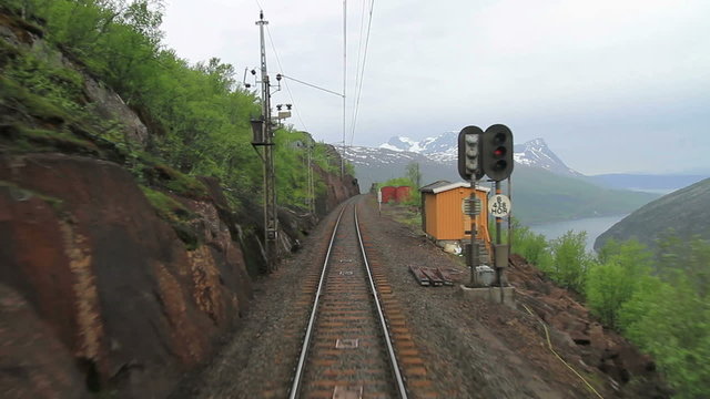 POV travelling along a Iron line Kiruna - Narvik, in Abisko National Park, Lapland, Sweden