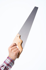 Hand holding a saw