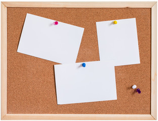 Blank papers pin up on cork board isolated on white background