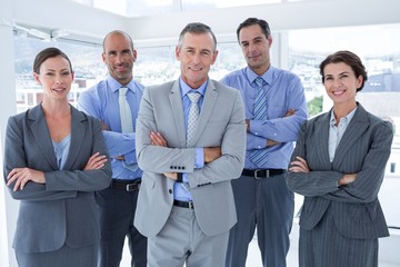 Business team working happily together on laptop