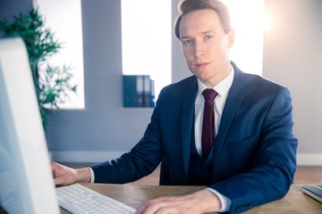 Confident businessman looking at camera